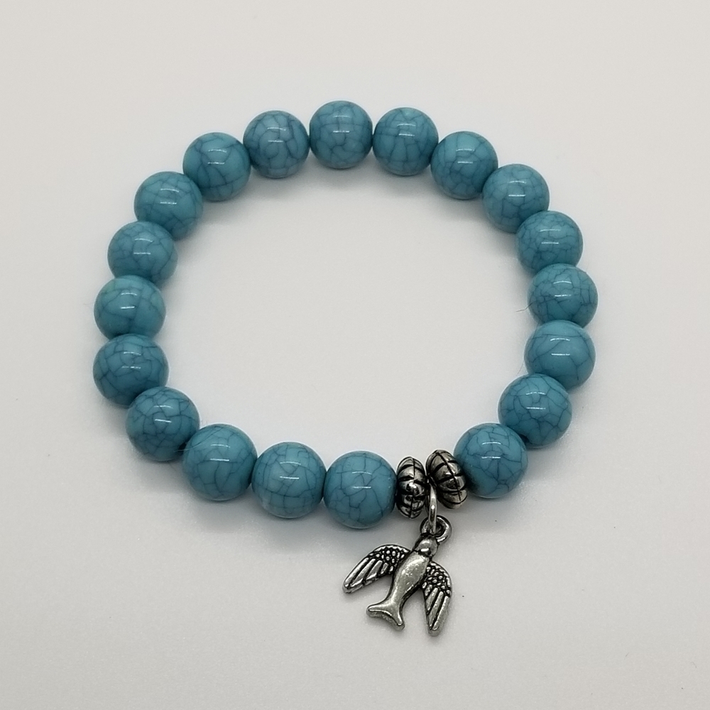blue bead stretch bracelet with bird charm